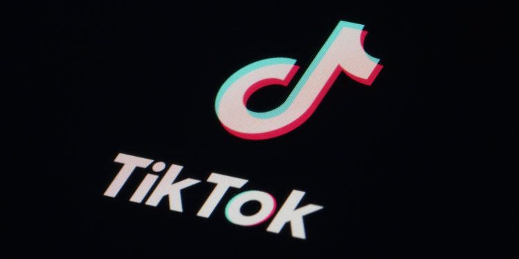 FILE - The icon for the video sharing TikTok app is seen on a smartphone, Feb. 28, 2023, in Marple Township, Pa. The state of Montana is asking a federal judge to allow its ban on downloading TikTok to take effect in January, even though the company argues it violates free speech rights. The state argues there are other apps that people can use to communicate with each other that don't include the risk of sharing data with the Chinese government. The company and content creators had asked the judge to temporarily block the law from taking effect while their legal challenge plays out. (AP Photo/Matt Slocum, File)