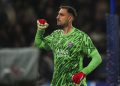 PSG's goalkeeper Gianluigi Donnarumma reacts after teammate Nuno Mendes scored their third goal during the Champions League quarterfinal first leg soccer match between Paris Saint-Germain and Aston Villa at Parc des Princes stadium in Paris, Wednesday, April 9, 2025. (AP Photo/Aurelien Morissard)