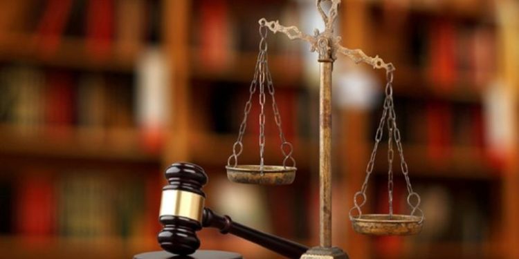 Gavel And Scales Of Justice On Desk In Law Office