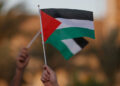 Iraqis raise the Palestinian flag during a rally in solidarity with Palestinians and in condemnation of Israel and the US in Baghdad on September 23, 2025. (Photo by AHMAD AL-RUBAYE / AFP) (Photo by AHMAD AL-RUBAYE/AFP via Getty Images)