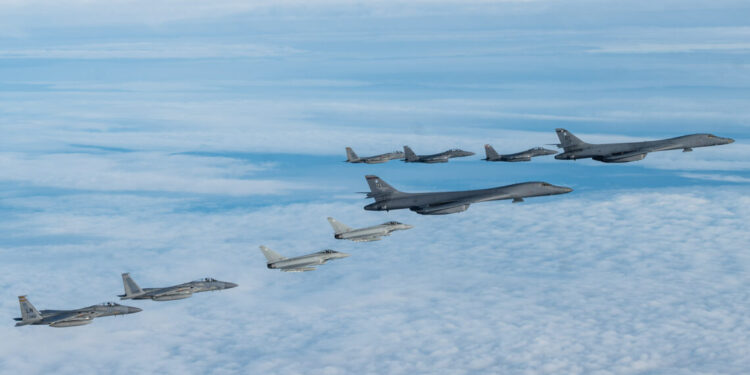U.S. Air Force F-15C Eagles, F-15E Strike Eagles, assigned to the 48th Fighter Wing, and Royal Air Force Typhoon FGR4s escort B-1 Lancer Bombers, assigned to Dyess Air Force Base, Texas, during a bomber task force mission in the North Sea Region, Nov. 10, 2021. The mission highlights U.S. capabilities and commitment to work closely with our allies and partners to deter any potential adversary from aggressive actions.  (U.S. Air Force photo by Senior Airman Koby I. Saunders)