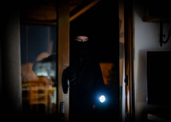 The thief breaks into the house through the balcony.