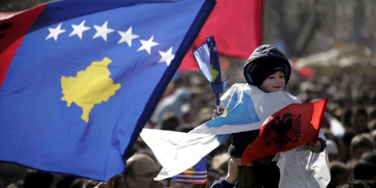 epa01638359 A Kosovo Albanian girl is holding a Kosovo flag as Kosovo Albanians take to the streets to mark the first anniversary of their declaration of independence from Serbia in Pristina, Kosovo on 17 February 2009. Kosovo declared independence on 17 February 2008. Recognised as independent by more than 50 countries including the United States and most EU states, but not recognised by others including Russia, China and Serbia, Kosovo's political stability is precarious.  EPA/ERMAL META